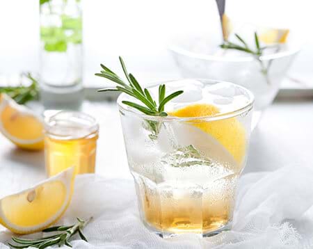 healthy sparkling water with lemon rosemary and honey