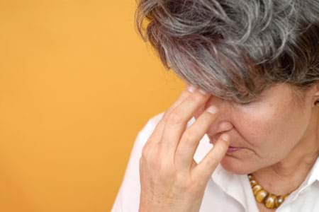 woman experiencing hormonal imbalance and irritability in perimenopause