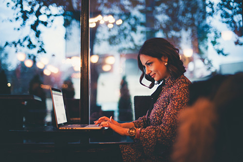 A woman on her computer choosing birth control