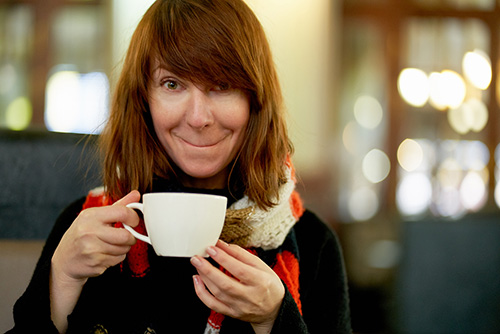 Woman drinking tea for the many health benefits