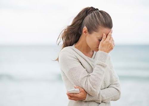 A woman frustrated with chronic inflammation thinking about her treatment options