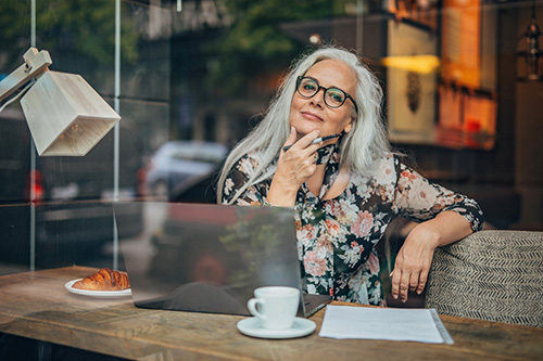 woman in cafe concerned about her irregular periods