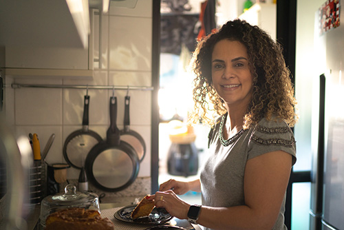 Woman in kitchen thinking about the best way to get off prempro and switch to natural hormonal support