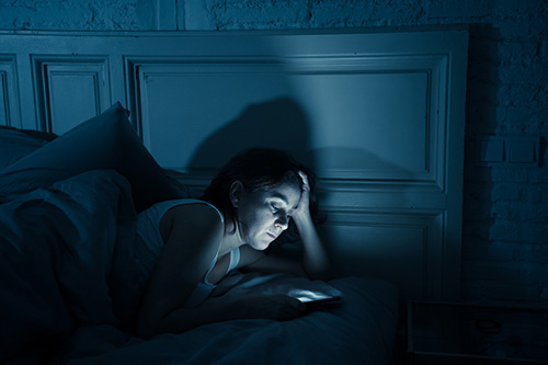One of the top causes of insomnia in women is too much sleep-disrupting blue light from smartphones before bed
