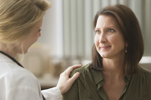 Women talking to her doctor about what is involved in a total hysterectomy.