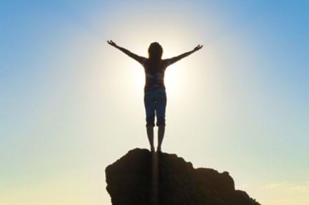 woman with her arms raised