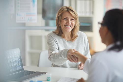 Woman Talking To Her Doctor About Uterine Fibroid Embolization