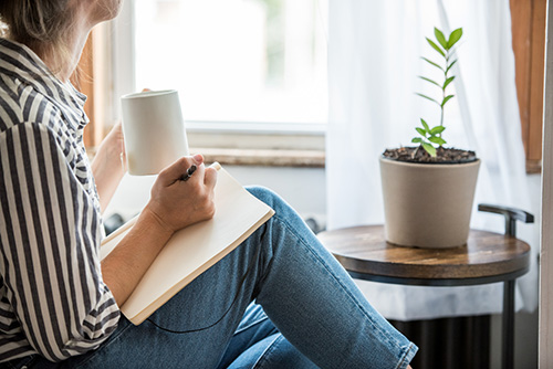 A calm woman journaling