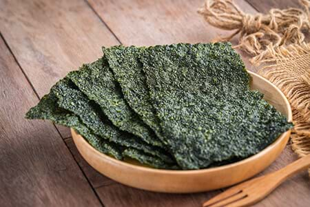 crispy seaweed on wooden plate