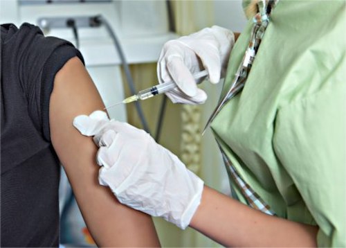 A woman getting a flu shot