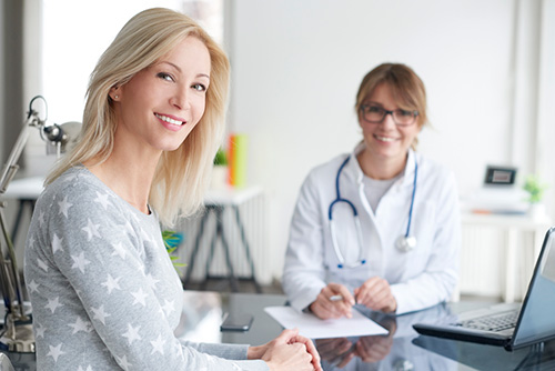 A woman is talking to her doctor