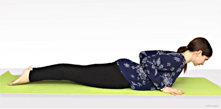 Kelley doing Cobra Pose (Bhujangasana)