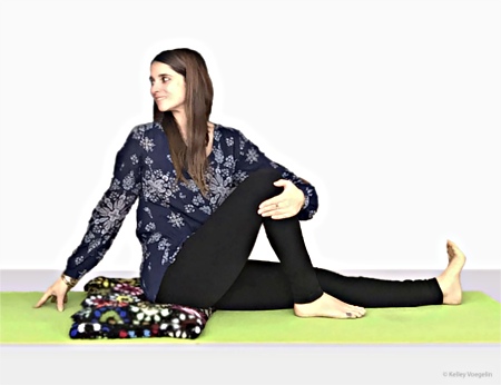 Kelley doing Seated Spinal Twist (Ardha Matsayendrasana)