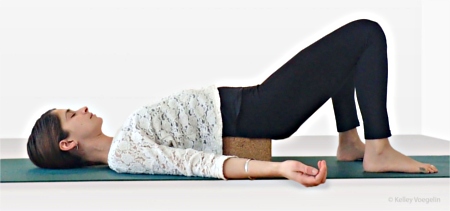 Supported Bridge Pose using one yoga block