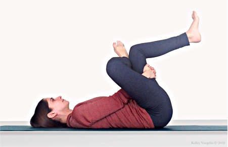 Woman in Supine Pigeon Pose (Supta Kapotasana)