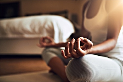 A woman practicing yoga for low libido