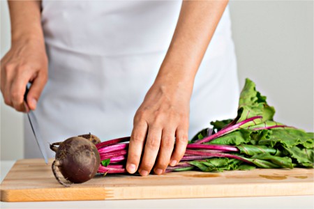 Woman chopping beets