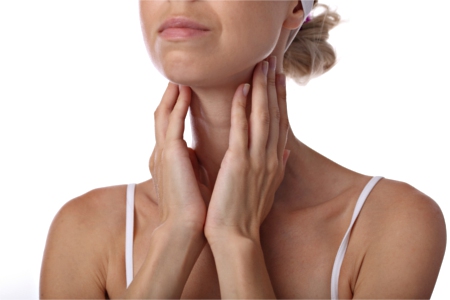 Woman touching her thyroid