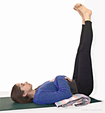 Woman doing Legs-Up-The-Wall yoga pose