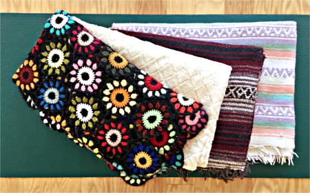 Variety of regular blankets and yoga blankets for a home yoga practice Regular blankets and yoga blankets
