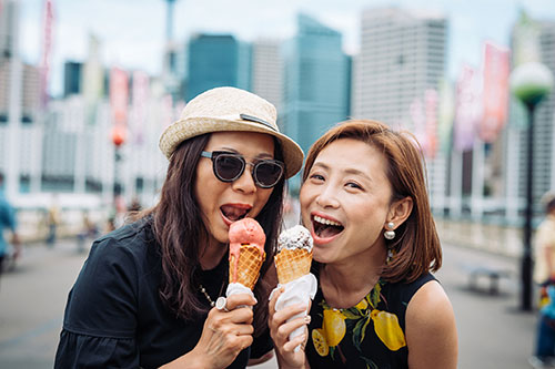 two women enjoying ice cream together