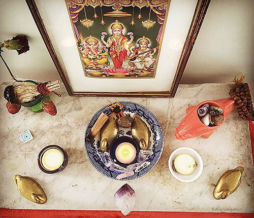 a meditation altar with candles and meaningful objects