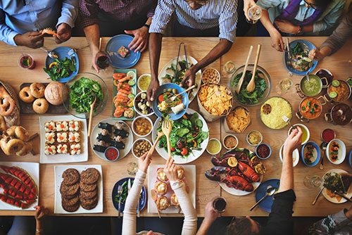 Friends eating together at holiday party. friends at holiday brunch party