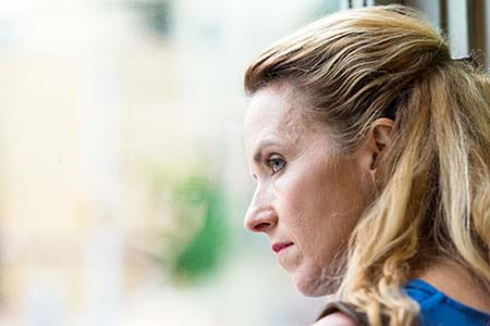 A woman with irritable bowel syndrome is often controlled by its symptoms. A woman with irritable bowel syndrome