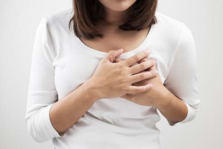 Woman holding painful breast. woman holding painful breast