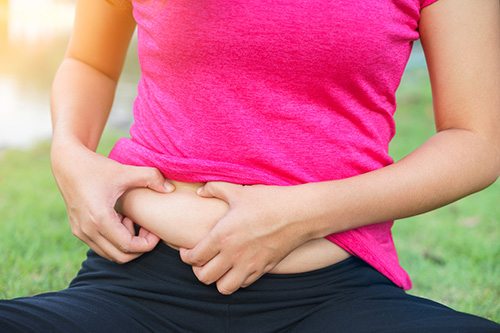 a woman in menopause can shed belly fat when she can pinpoint its true cause