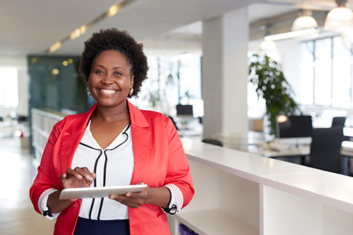 A smiling woman is happy that she resolved her urinary tract symptoms