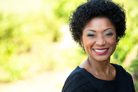 smiling woman with healthy thyroid