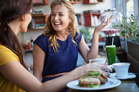 two women enjoying a healthy lunch together