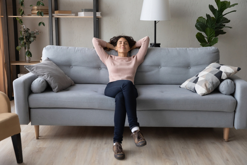 woman relaxed on sofa