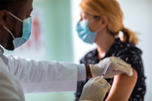 A woman getting her Covid shot