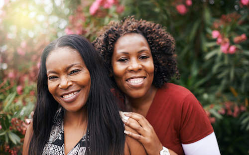 A happy mother an daughter feeling lucky to know their family history of fracture risk. 