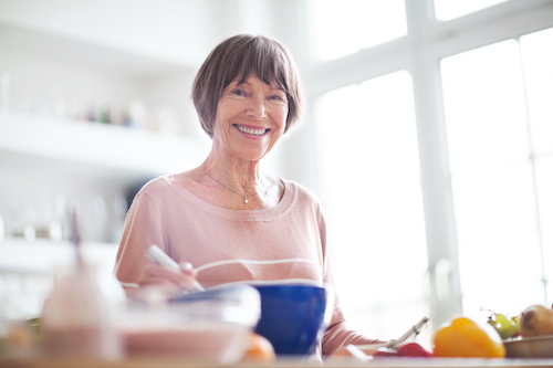 Woman eating an alkaline diet for bone health.