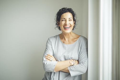 woman laughing not worried about stress urinary incontinence