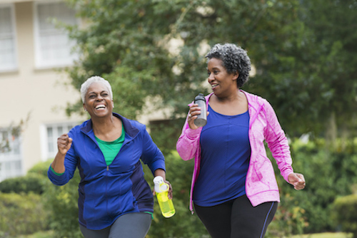 Two women walking for bone health. 