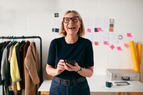 Woman at work happy about advancements in women's health and wellness