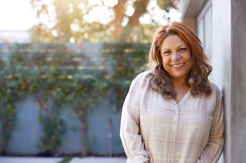 A woman supporting her immune health by getting outside to soak up Vitamin D.