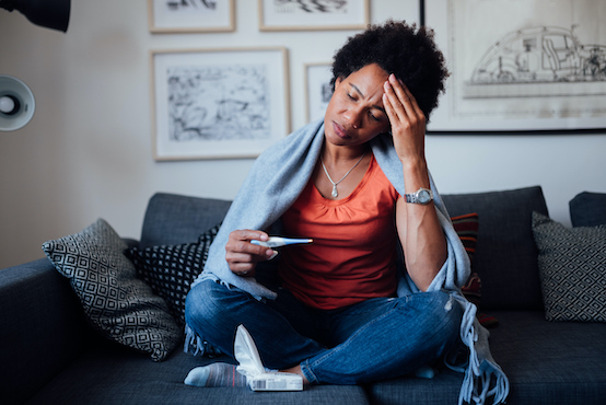 Woman Feeling Symptoms Of An Illness