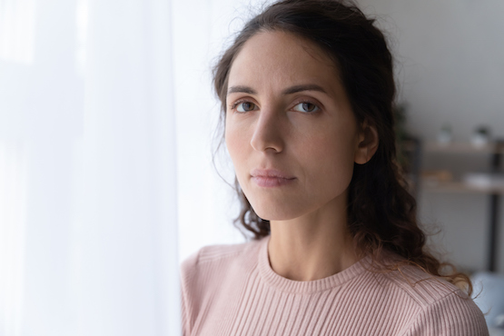 Close Up Portrait Of Serious Joyless Female